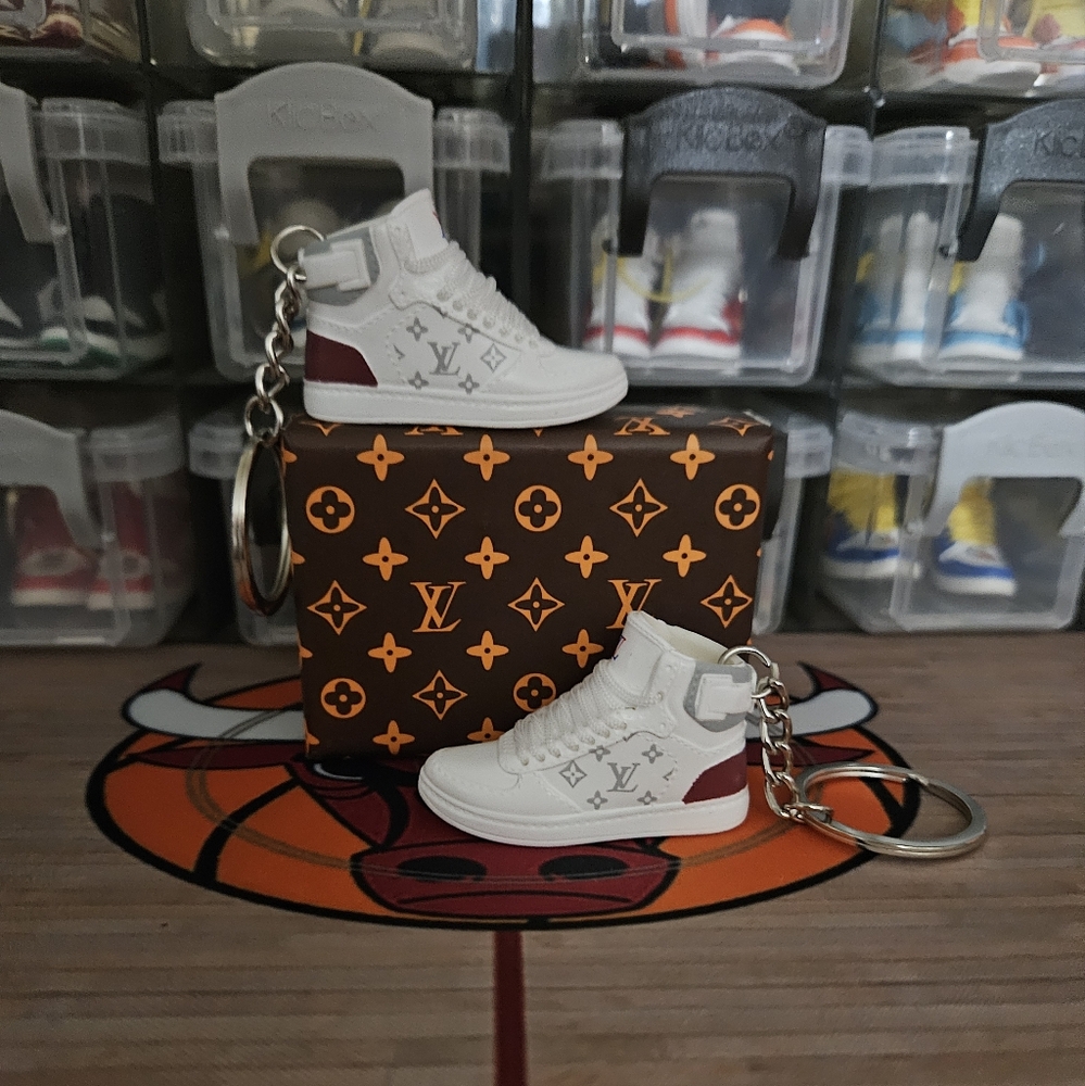 Fashion pair of mini sneakers keychain.